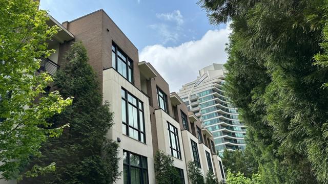Modern apartment buildings in Atlanta framed by trees